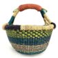 Front view of the small round Bolga basket with lime, teal and navy bands, on a white background