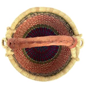 small-round-basket-732-power-red-green-woven-bolga-bashiri-2 Top-down view inside the small round Bolga basket with red checks under green and navy bands, showing the coiled base