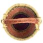 Top-down view inside the small round Bolga basket with red checks under green and navy bands, showing the coiled base