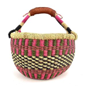 Front view of the small round Bolga basket with a checked pattern in warm, deep tones