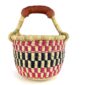 Front view of the small round Bolga basket with a bold chequered pattern in bright and dark tones
