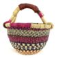 Front view of the small round Bolga basket with bands and checked detail in deep, warm tones