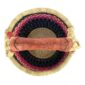 Top view of the small round Bolga basket showing the coiled base and leather-wrapped handle
