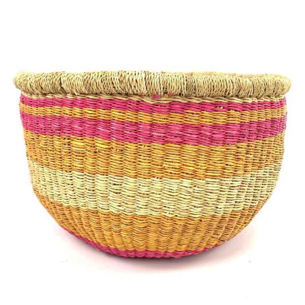 uba-basket-278-sideshow-pink-orange-round-storage-woven-bashiri-3 Front view of the round Bolga storage basket with pink, orange and yellow bands on natural straw and no handles on a white background
