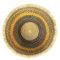 Top view inside the round Bolga storage basket with a black and natural check, a mustard band and a teal and orange rim band, with no handles