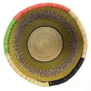 Top-down view inside the olive and black round Bolga basket, showing the coiled base