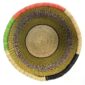Top-down view inside the olive and black round Bolga basket, showing the coiled base