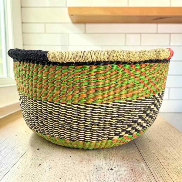 Round Bolga basket with no handles in olive and black, handwoven from elephant grass