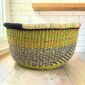 Round Bolga basket with no handles in olive and black, handwoven from elephant grass