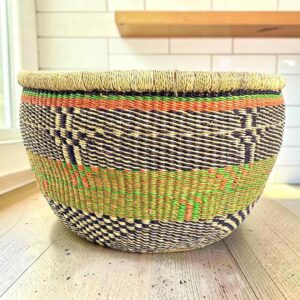 Round Bolga basket with no handles in green and black, handwoven from elephant grass