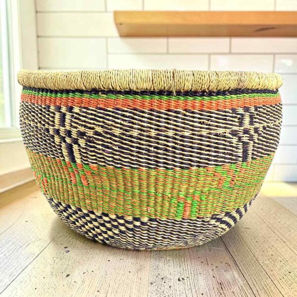 uba-basket-287-pops-green-black-vegan-bolga-woven-bashiri-main Round Bolga basket with no handles in green and black, handwoven from elephant grass