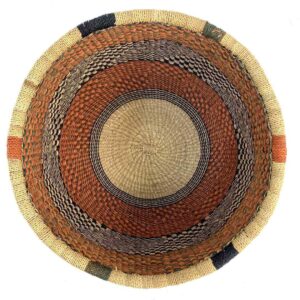 uba-basket-288-crunchy-rust-black-vegan-bolga-african-basket-bashiri-2 Top-down view inside the rust and black round Bolga basket, showing the coiled base