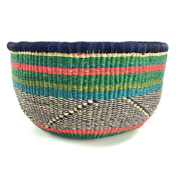 uba-basket-290-twisty-green-pink-vegan-bolga-handwoven-bashiri-3 Front view of the green and pink round Bolga basket on a white background