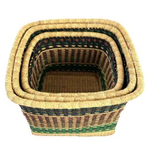 Top view of three Vounu square baskets nested inside each other, showing the woven rims and natural grass base.