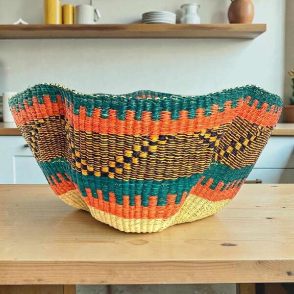 Bolga wave basket in teal and orange, handwoven from elephant grass