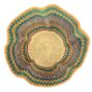 Top-down view inside the orange, teal and purple bolga wave basket, showing the coiled base