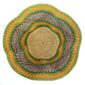 Top-down view inside the green and orange bolga wave basket, showing the coiled base