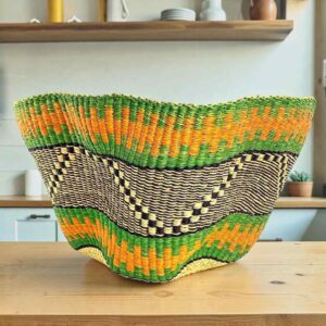 Bolga wave basket in green and orange, handwoven from elephant grass