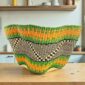 Bolga wave basket in green and orange, handwoven from elephant grass
