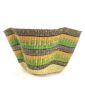 Front view of the green and yellow bolga wave basket on a white background