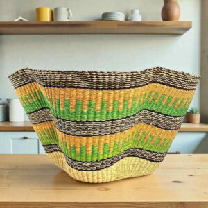 Bolga wave basket in green and yellow, handwoven from elephant grass