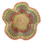 Top-down view inside the pink and green bolga wave basket, showing the coiled base