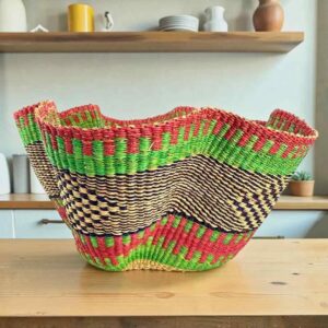 Bolga wave basket in pink and green, handwoven from elephant grass