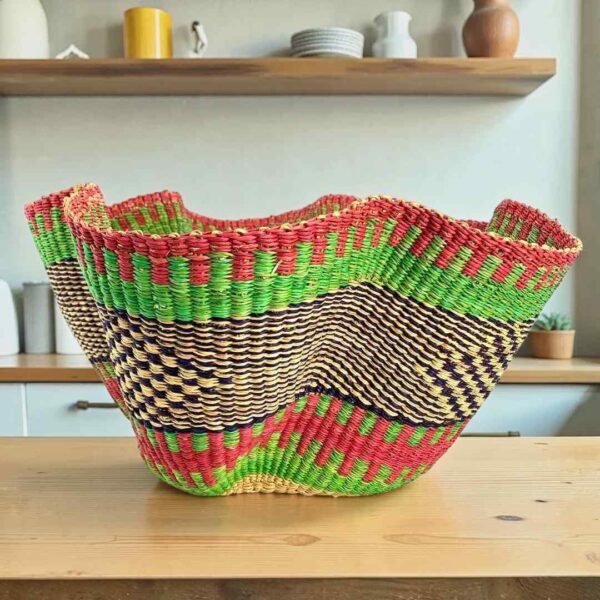 wave-basket-093-hello-pink-green-woven-bolga-bashiri-main Bolga wave basket in pink and green, handwoven from elephant grass