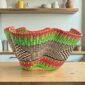 Bolga wave basket in pink and green, handwoven from elephant grass