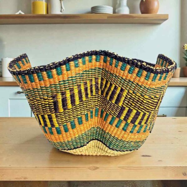 Bolga wave basket in orange and navy, handwoven from elephant grass