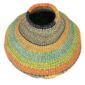 Angled view of the orange, teal and lime green Bolga wave pot basket showing the wave pattern detail