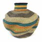 Front view of the teal and rust Bolga wave pot basket showing the woven neck