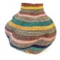 Front view of the teal, gold, rust, pink and purple Bolga wave pot basket
