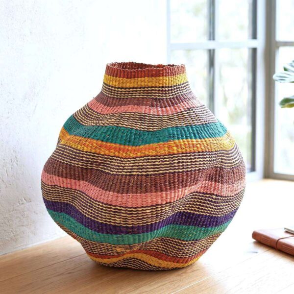 wavepot-005-cockatoo-main Bolga Wave Pot Basket in teal, gold, rust, pink and purple woven bands, styled on a timber floor by a window