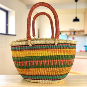 Mega Wawa basket with teal, rust, gold and green striped bands, leather handles