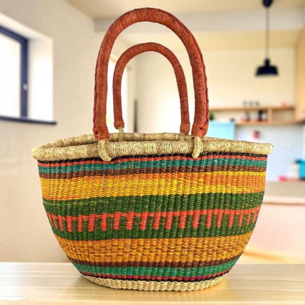 Mega Wawa basket with teal, rust, gold and green striped bands, leather handles
