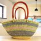 Mega Wawa basket with pink, green and navy horizontal stripes, leather handles