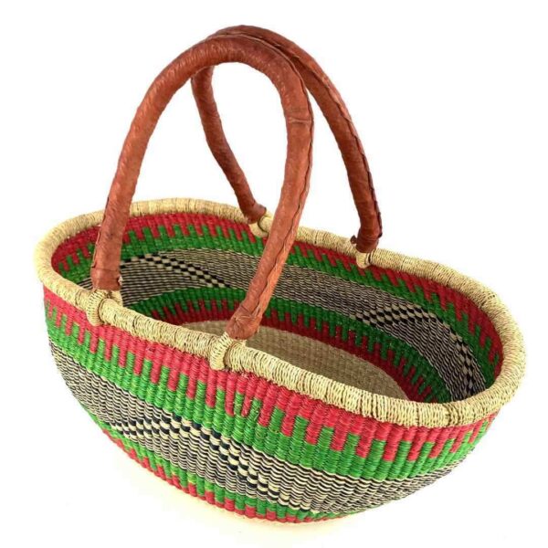 wawa-basket-258-spice-2 Angled view of the red and green Mega Wawa Bolga basket showing the woven interior and leather handles