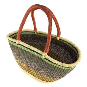 Angled view of the olive green and rust Mega Wawa Bolga basket showing the woven interior and leather handles
