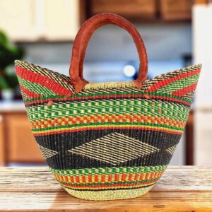 Classic market basket with bold multicolour bands around a dark diamond pattern and leather-wrapped handles