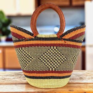 Classic market basket with warm, earthy stripes around a dark diamond pattern and leather-wrapped handles