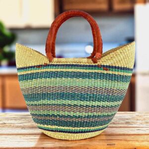 Classic market basket with soft, cool-toned stripes below a natural rim and leather-wrapped handles