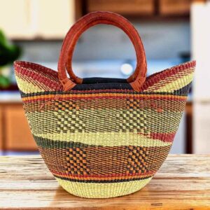 Classic market basket with checked bands and a wave pattern in warm, earthy tones and leather-wrapped handles