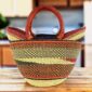Classic market basket with checked bands and a wave pattern in warm, earthy tones and leather-wrapped handles