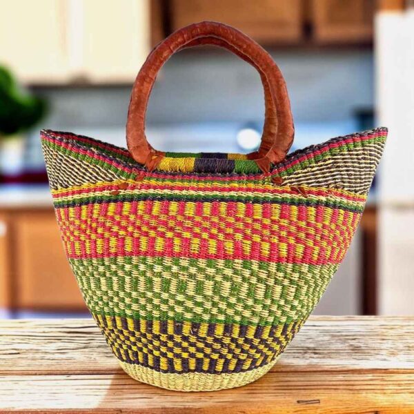 Classic market basket with stripes and checked bands in warm and fresh tones and leather-wrapped handles
