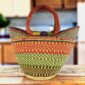 Classic market basket with stripes and checked bands in warm and fresh tones and leather-wrapped handles